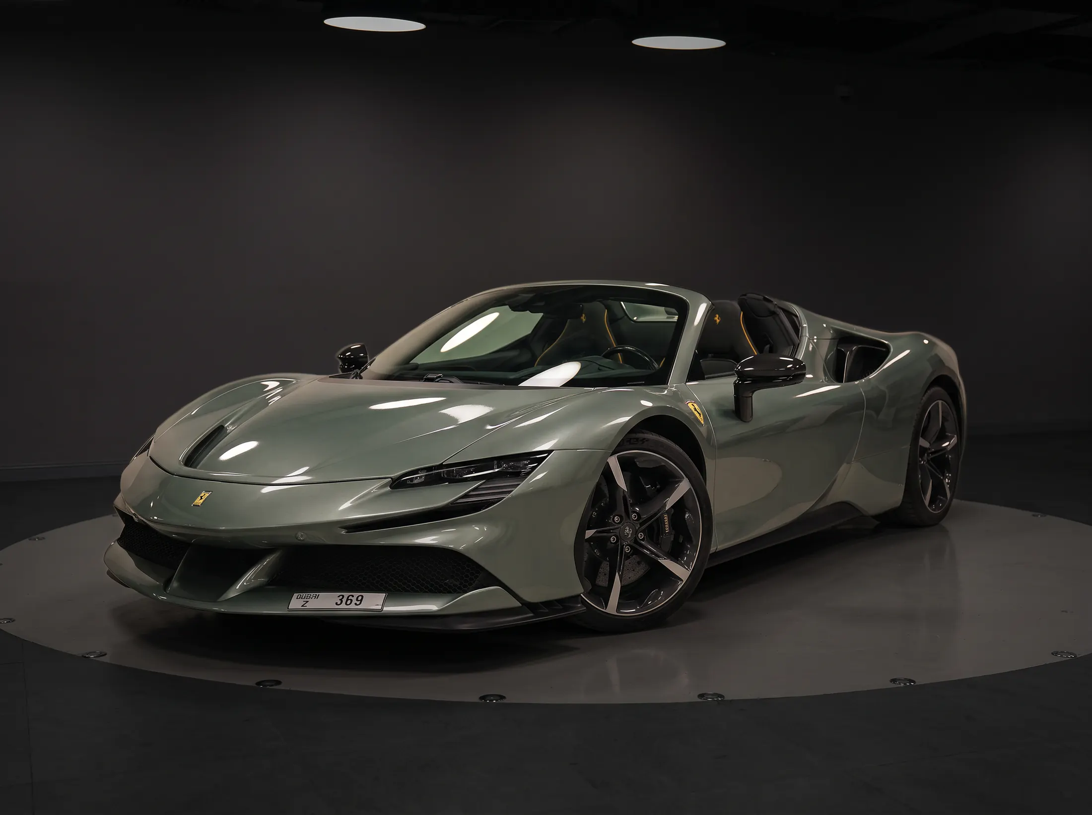 Ferrari SF90 with sage green paint protection film by Kynetik Koncepts, studio turntable
