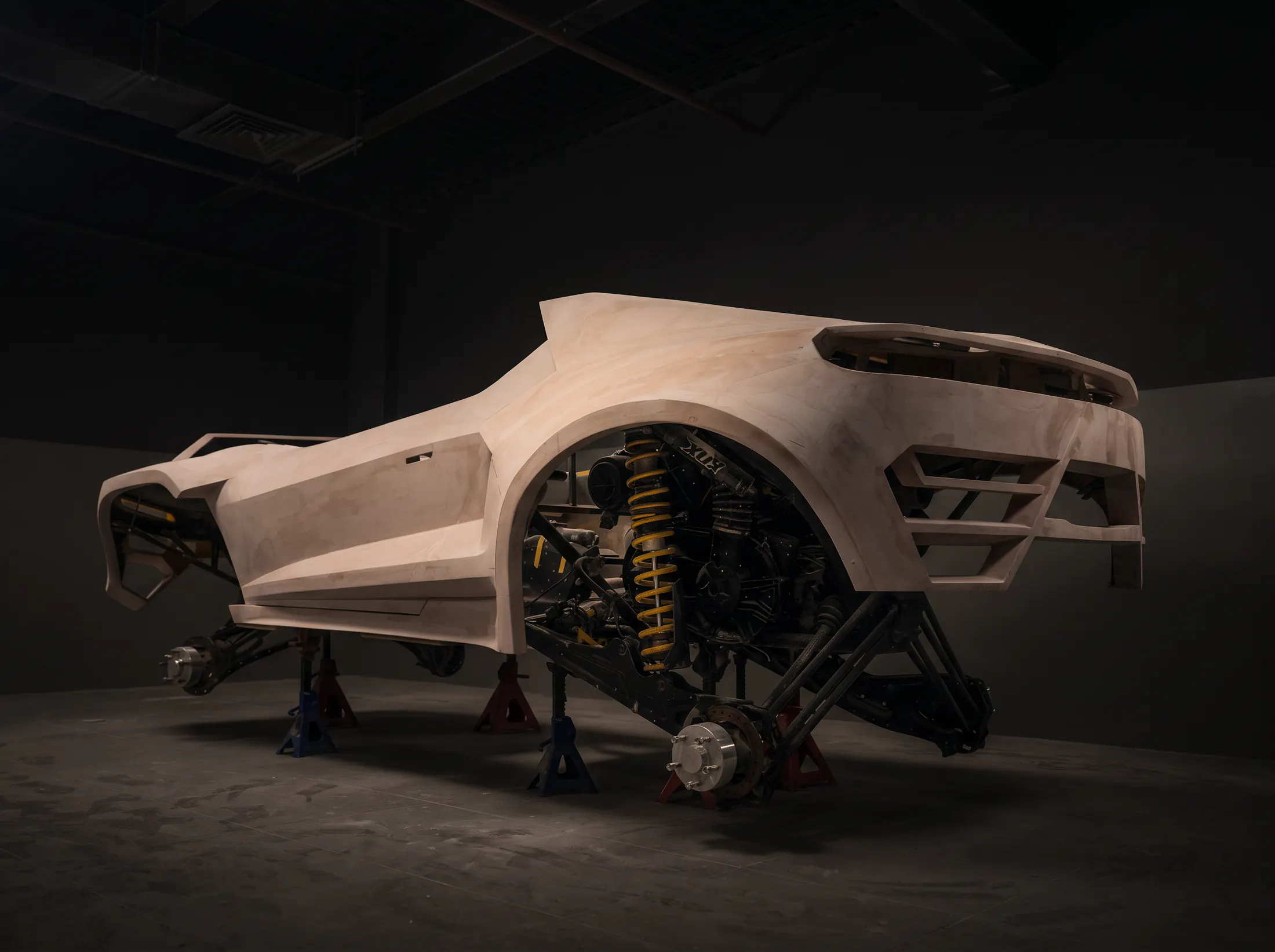 Vehicle prototyping at Kynetik Koncepts — prototype buggy body on stands in the Dubai workshop