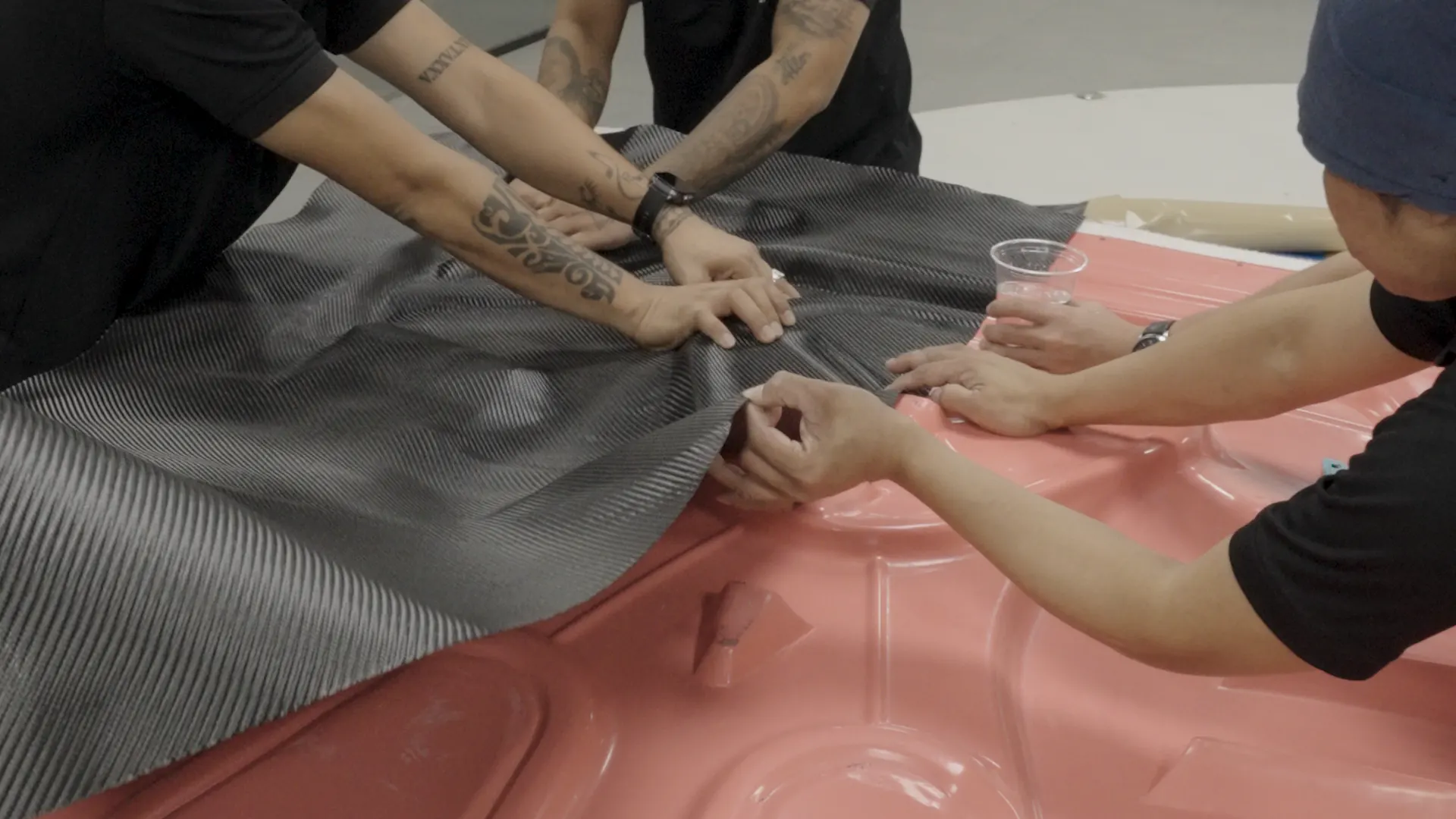 Hand-laying carbon fibre cloth into a mould at the Kynetik Koncepts workshop, Dubai