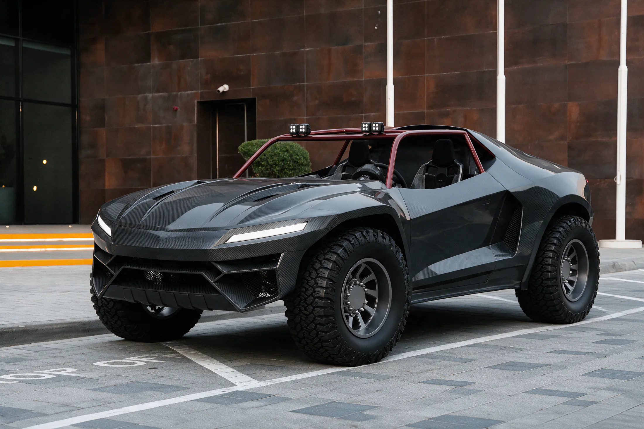 Karbon Toys Can-Am buggy by Kynetik Koncepts, carbon fibre body on off-road tyres, front three-quarter outside the Dubai showroom