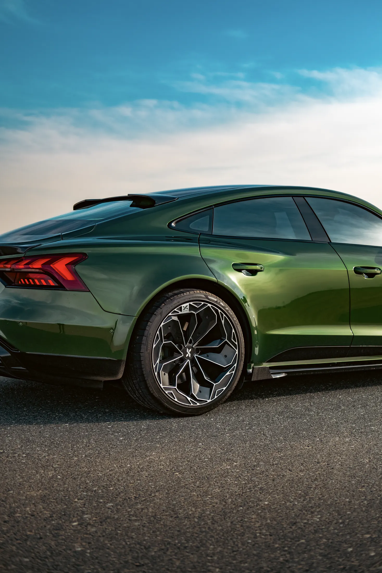 Audi RS e-tron GT by Kynetik Koncepts — rear three-quarter on a desert road