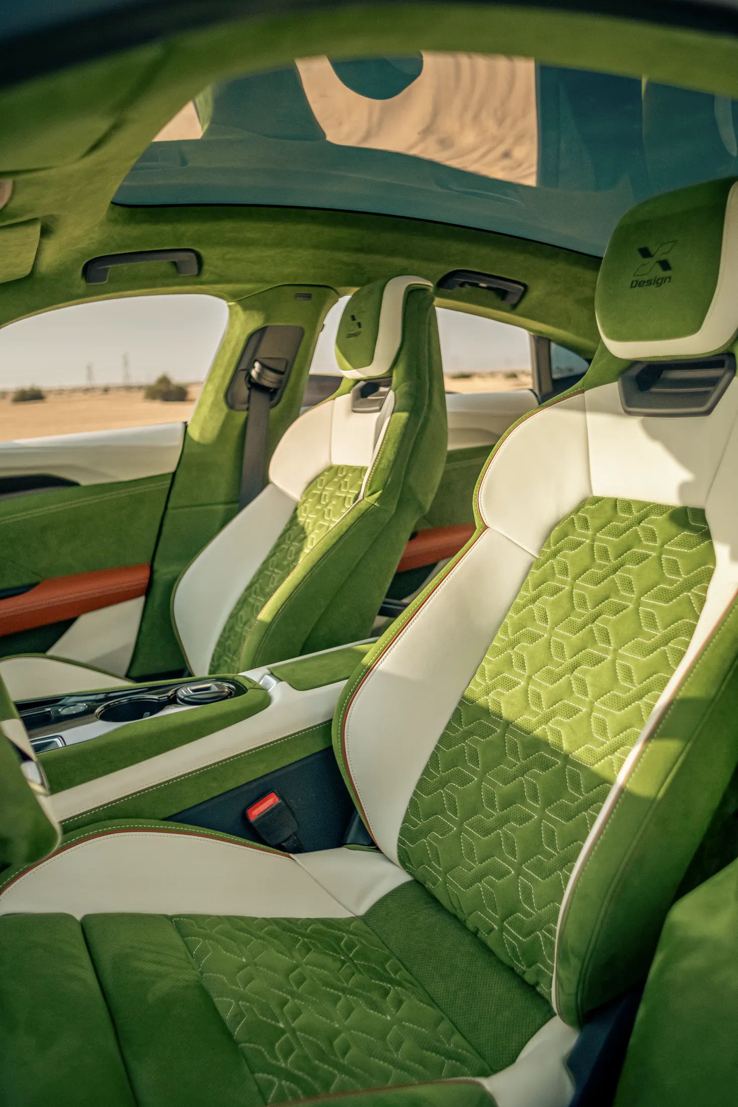 Audi RS e-tron GT interior retrim by Kynetik Koncepts — front seats in embossed green suede and cream leather