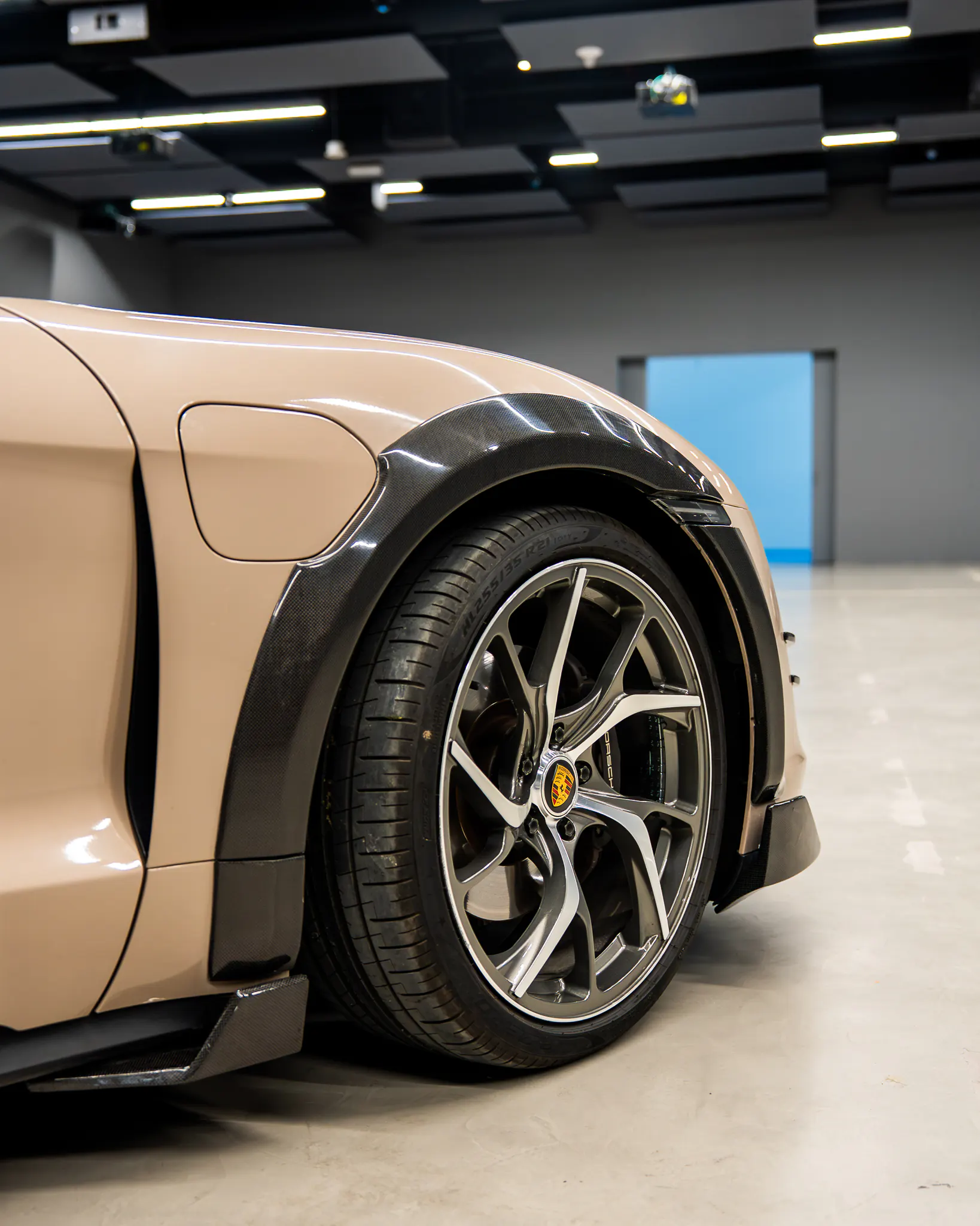 Porsche Taycan by Kynetik Koncepts — carbon front arch and wheel