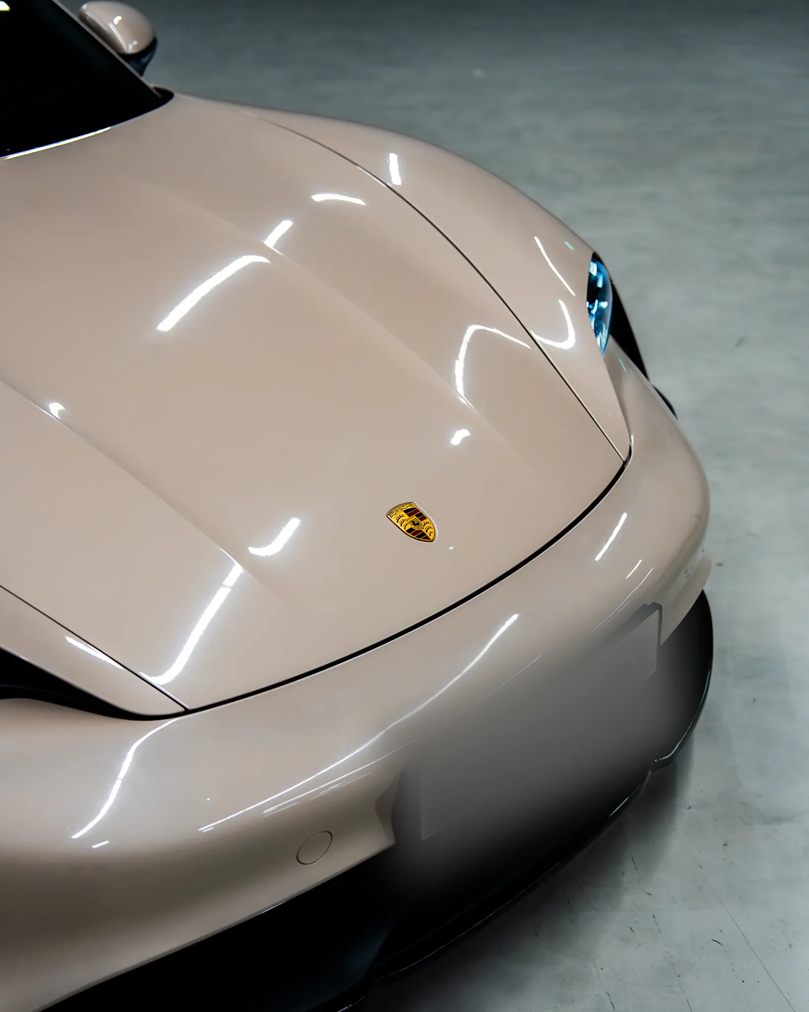Porsche Taycan by Kynetik Koncepts — bonnet and crest detail