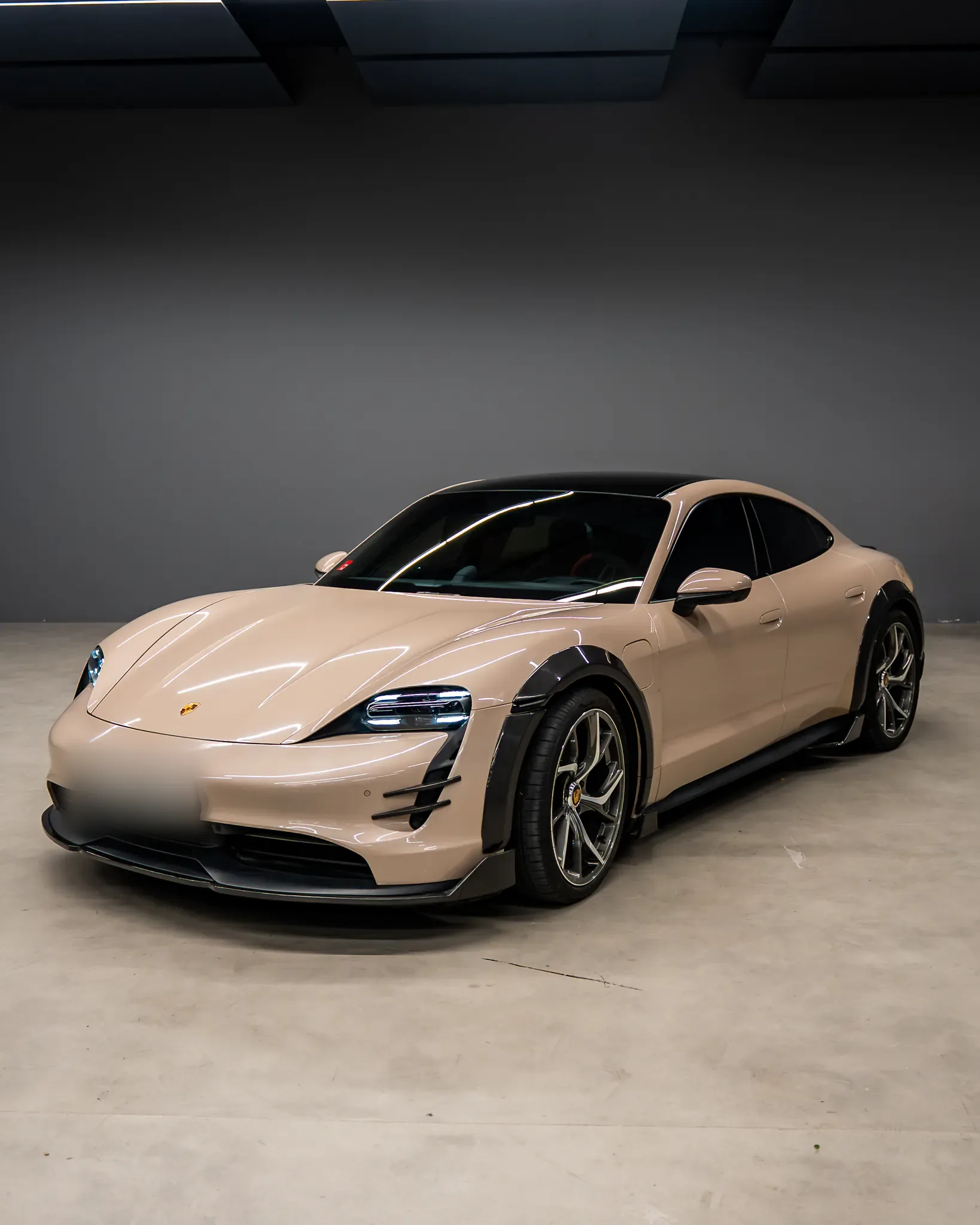 Porsche Taycan by Kynetik Koncepts — front three-quarter, carbon wide arches