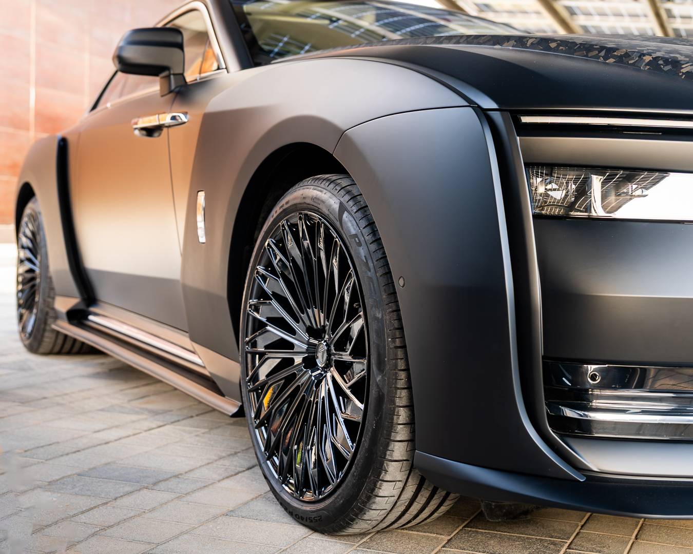 Matte black Rolls-Royce, front three-quarter — the return of the coachbuilt car